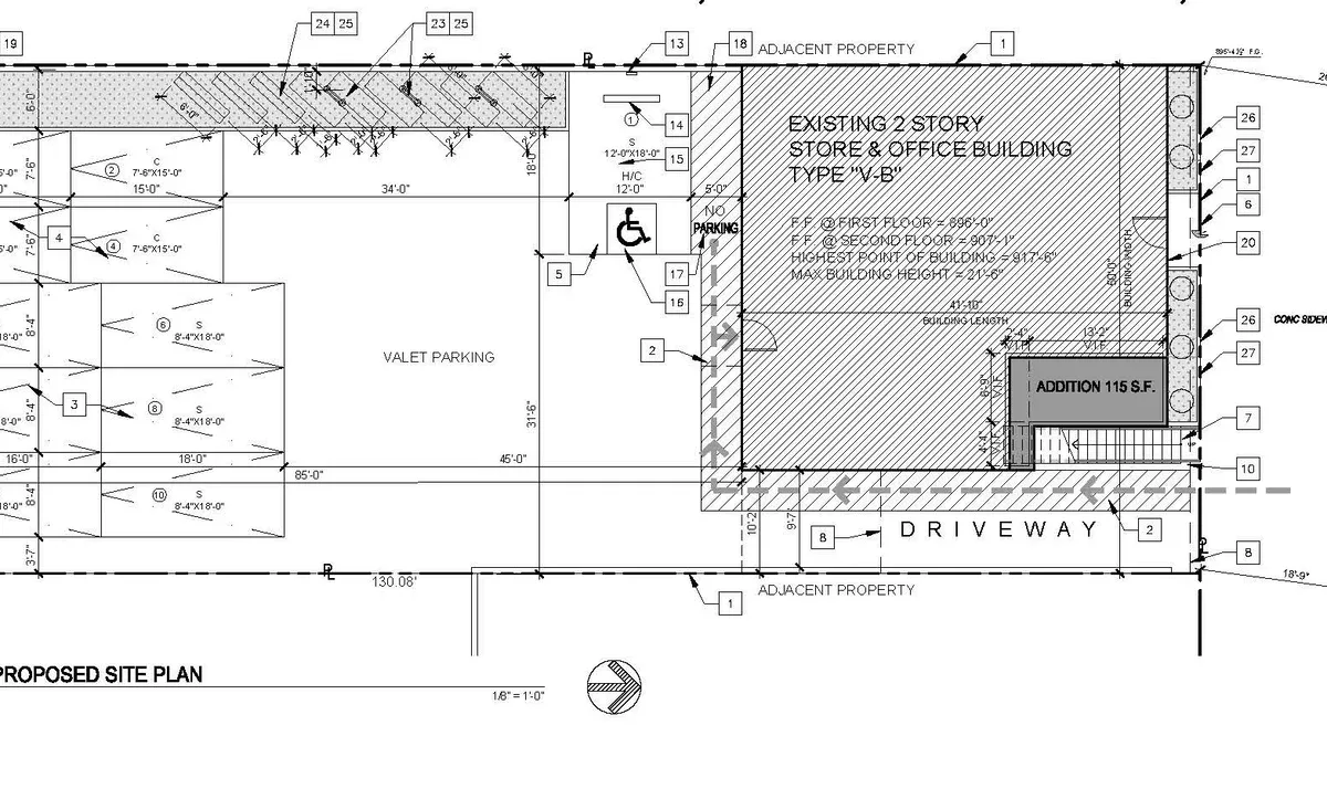 Architectural site plan showing zoning setbacks and parking